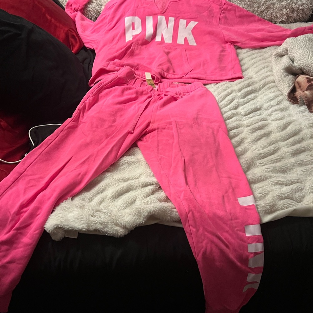 Pink suit the top is x large bottom is extra small